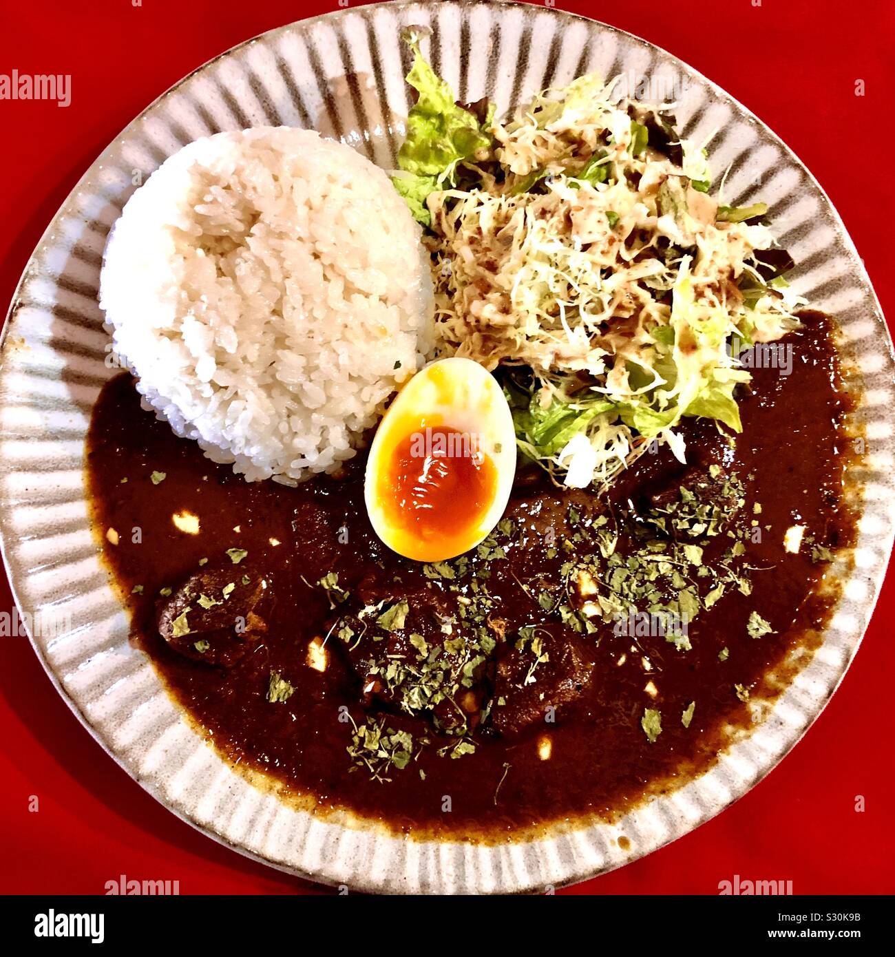 Curry with rice and soft boiled egg, Japanese style Stock Photo - Alamy