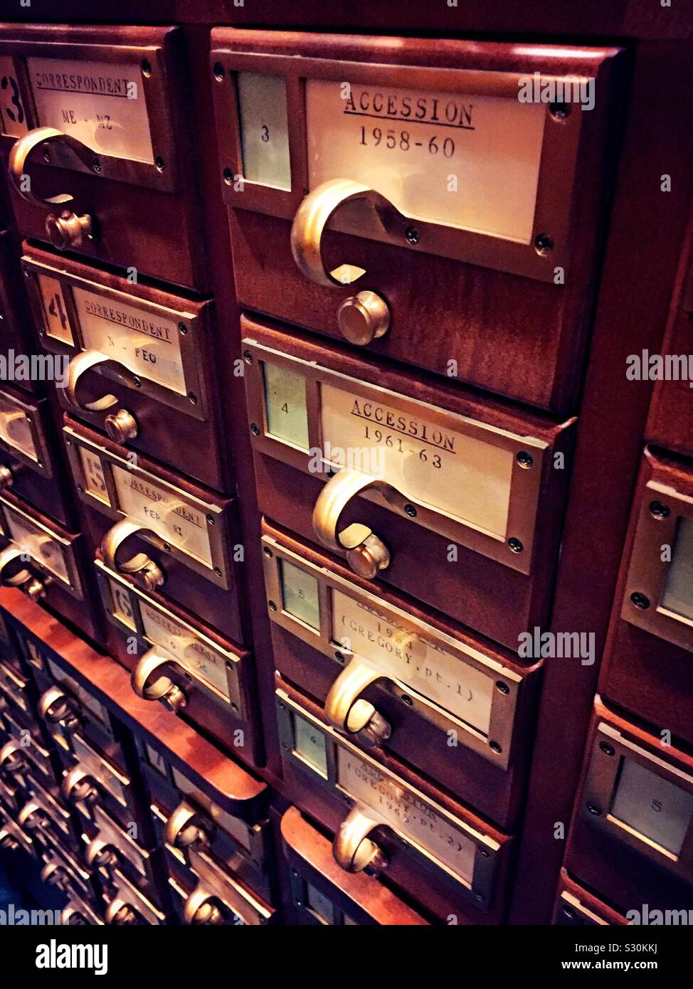 Vintage card catalog drawers at a public library, USA - Smartphone Captured Stock Image