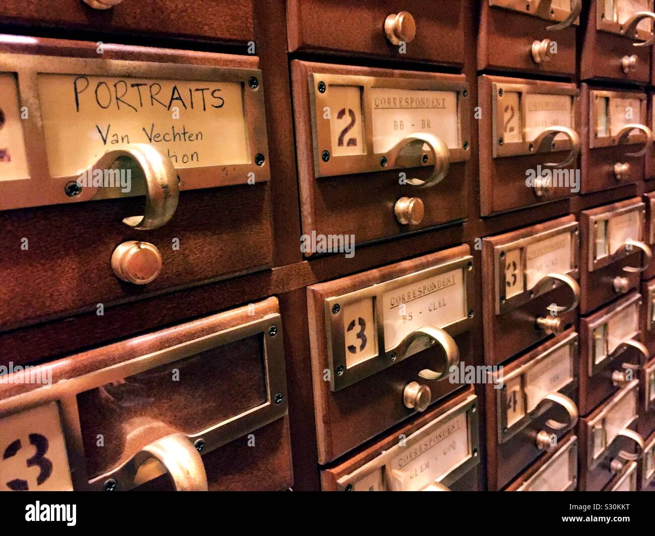 Vintage card catalog drawers in a public library in the United States - Smartphone Captured Stock Image