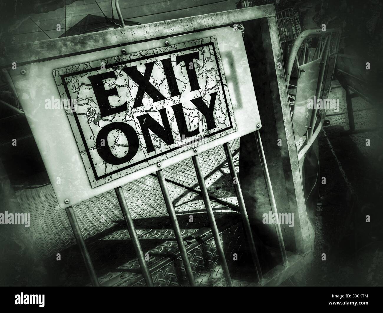 Distressed exit sign on carnival ride gate - Smartphone Captured Stock Image