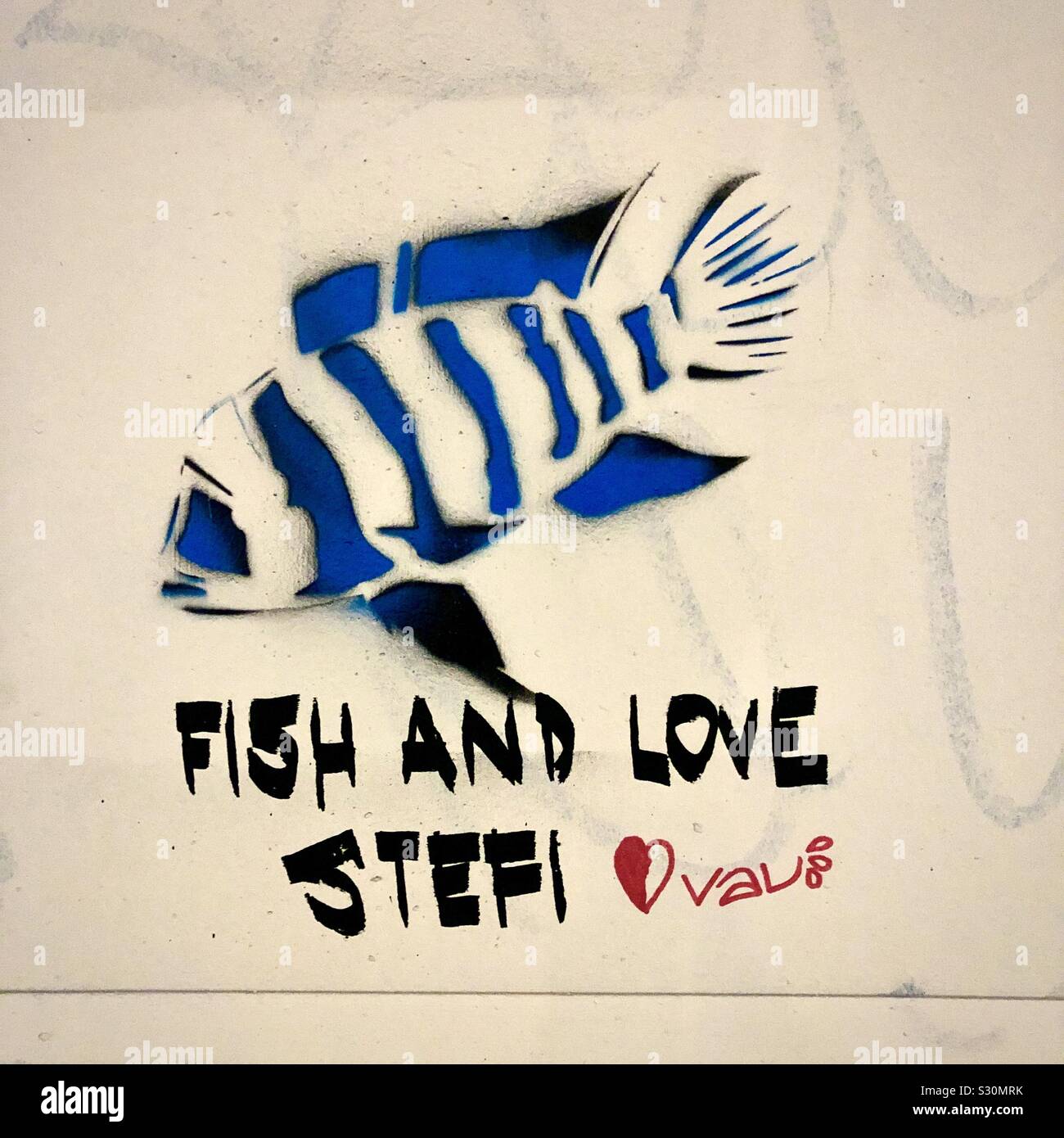 Strange graffiti tagging love message seen in Montmartre, Paris, France. - Smartphone Captured Stock Image