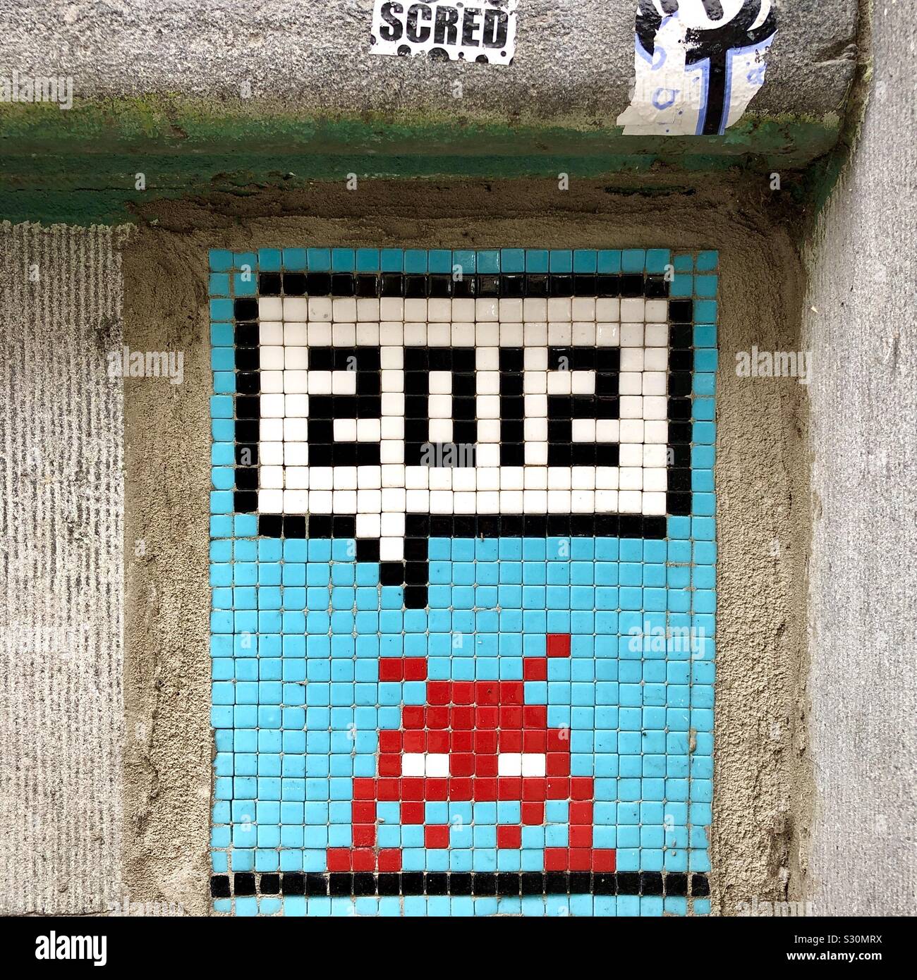 Street art mosaic by « Invader » in Saint-Gilles, Brussels, Belgium. Stock Photo
