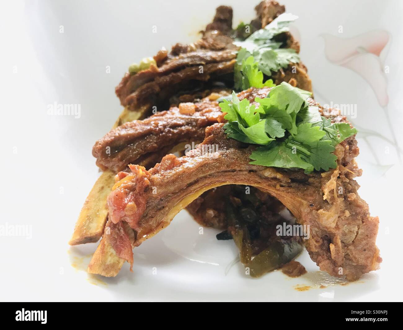 Dhaba style mutton ribs dish on a white background , indian, Punjabi dish, steak Stock Photo Alamy