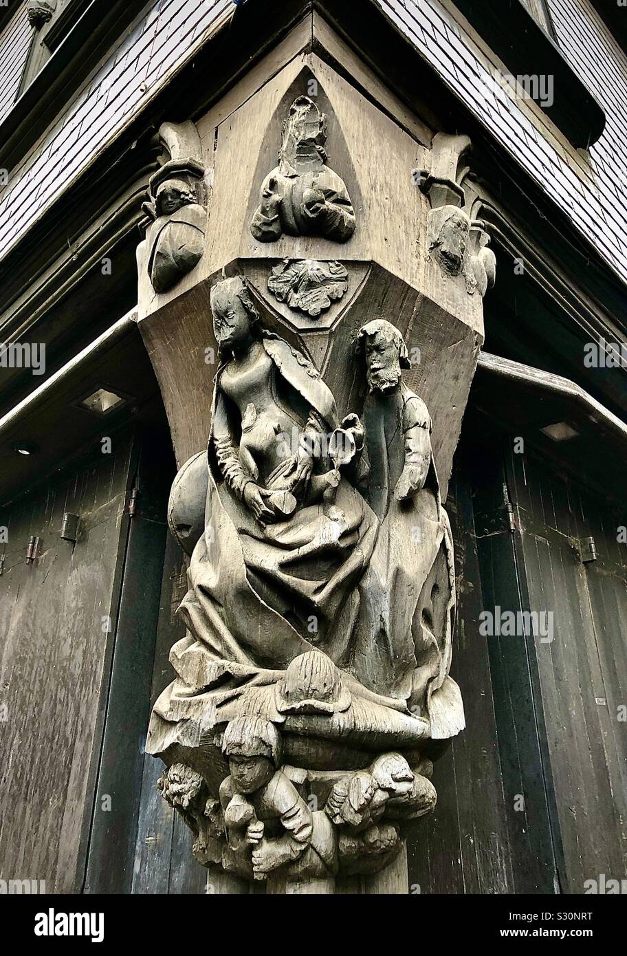 Ornate 15/16th century medieval wood carving of figures on corner of Place Plumereau, Tours, Indre-et-Loire, France. Stock Photo