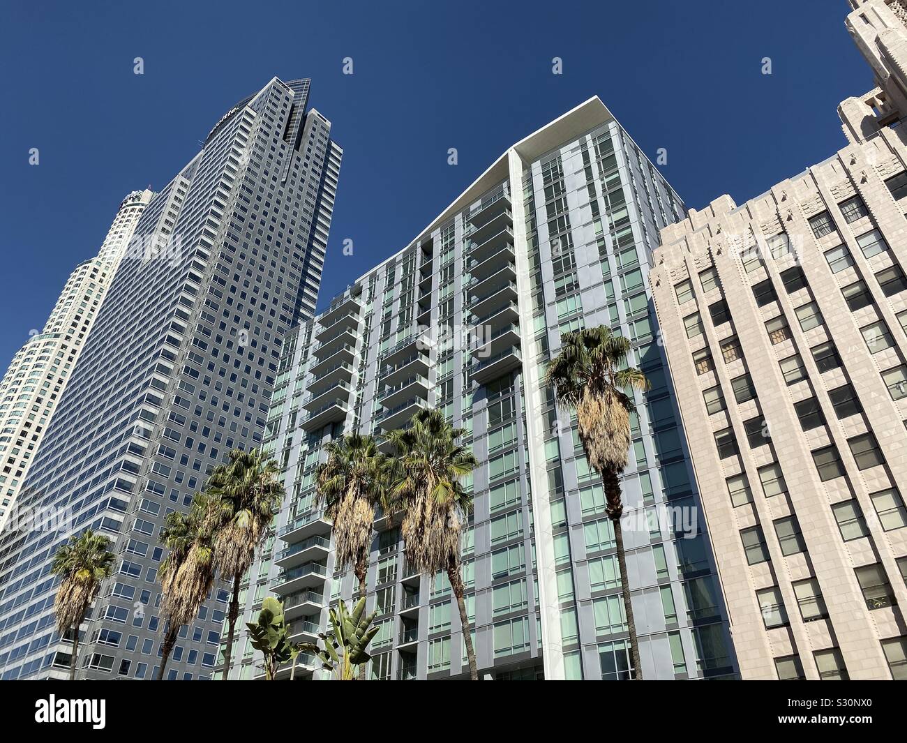 LOS ANGELES, CA, NOV 2019: old and new apartment blocks next to office skyscrapers in Downtown near Pershing Square - Smartphone Captured Stock Image