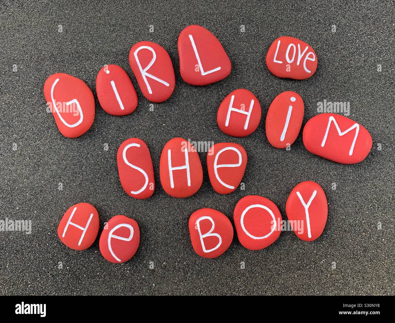 Gender text carved and red painted jumbled togheter - Smartphone Captured Stock Image