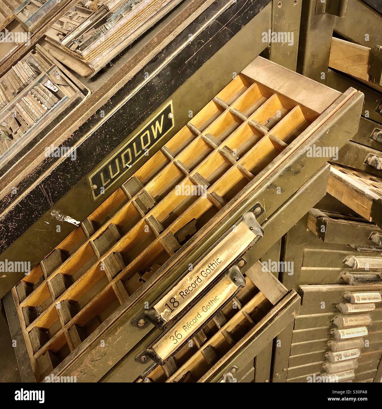 Old printers metal type drawers Stock Photo Alamy