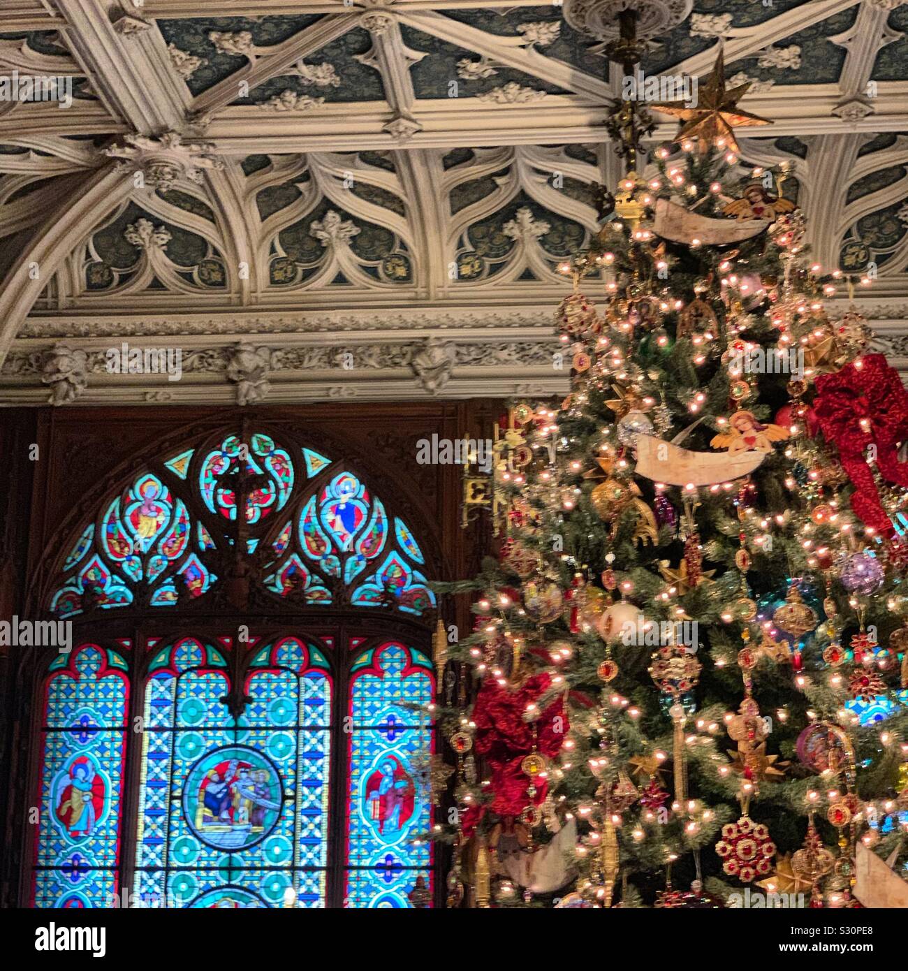 Stained glass window, ceiling detail, and Christmas tree, Gothic Room, Marble House, Newport