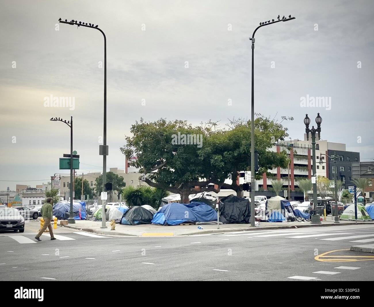 LOS ANGELES, CA, DEC 2019: homeless encampment with tents on a corner in the Downtown Historic Core - Smartphone Captured Stock Image