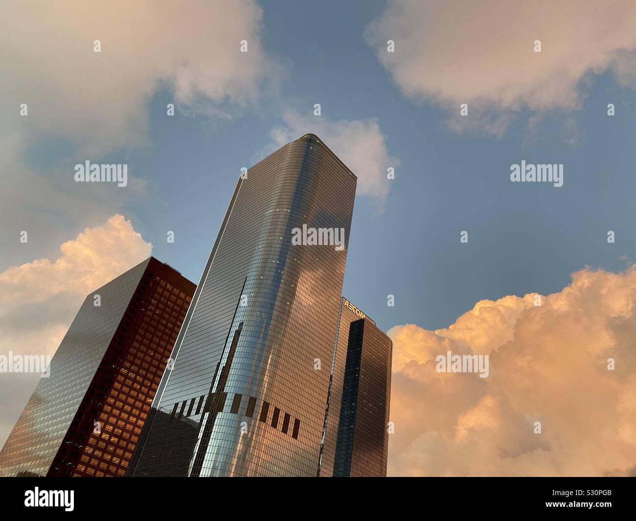 LOS ANGELES, CA, NOV 2019: looking up at skyscrapers in California Plaza at sunset, with copper orange clouds, in the Financial District of Downtown Stock Photo
