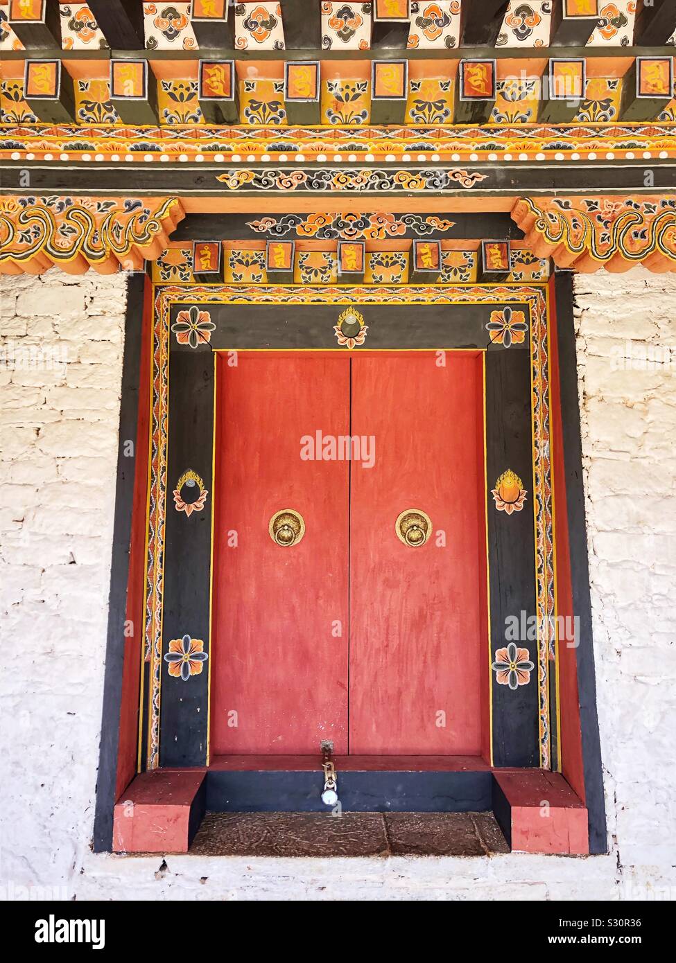 Closed door, entrance to a Buddhist monastery in Bhutan. - Smartphone Captured Stock Image