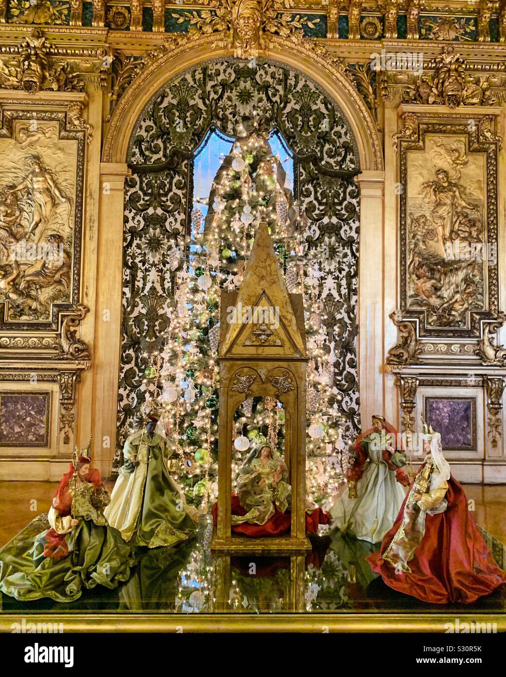 Crèche amid the opulent interior decor during the Christmas season at Marble House, Newport, Rhode Island, United States - Smartphone Captured Stock Image