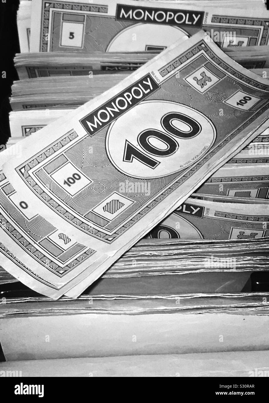 Monopoly money notes in black and white Stock Photo