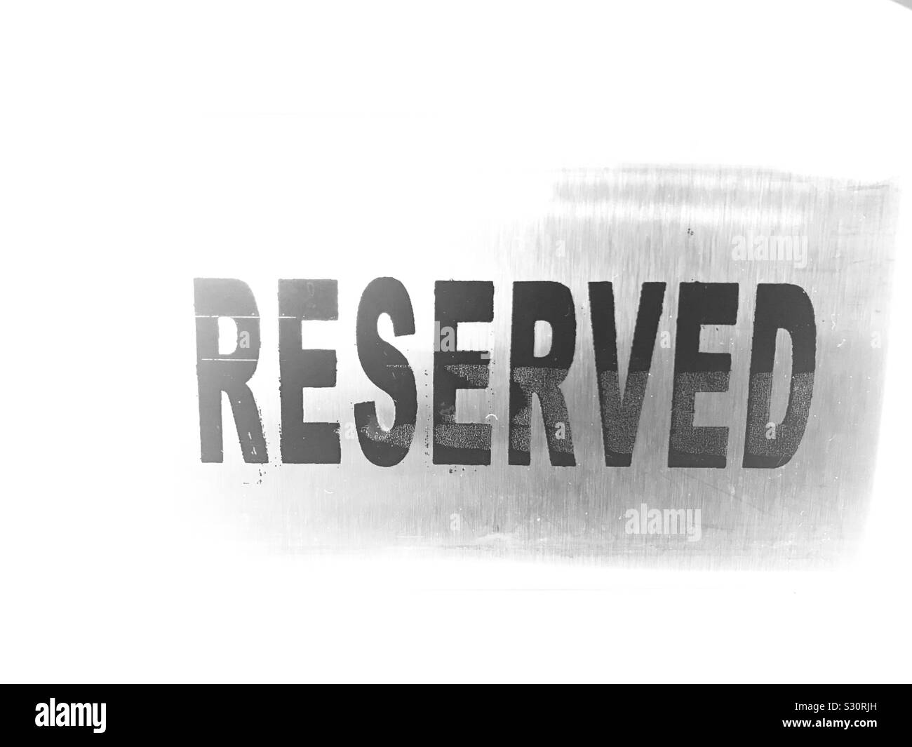 Metal table Reserved sign on a restaurant in Singapore , Reserve Stock Photo