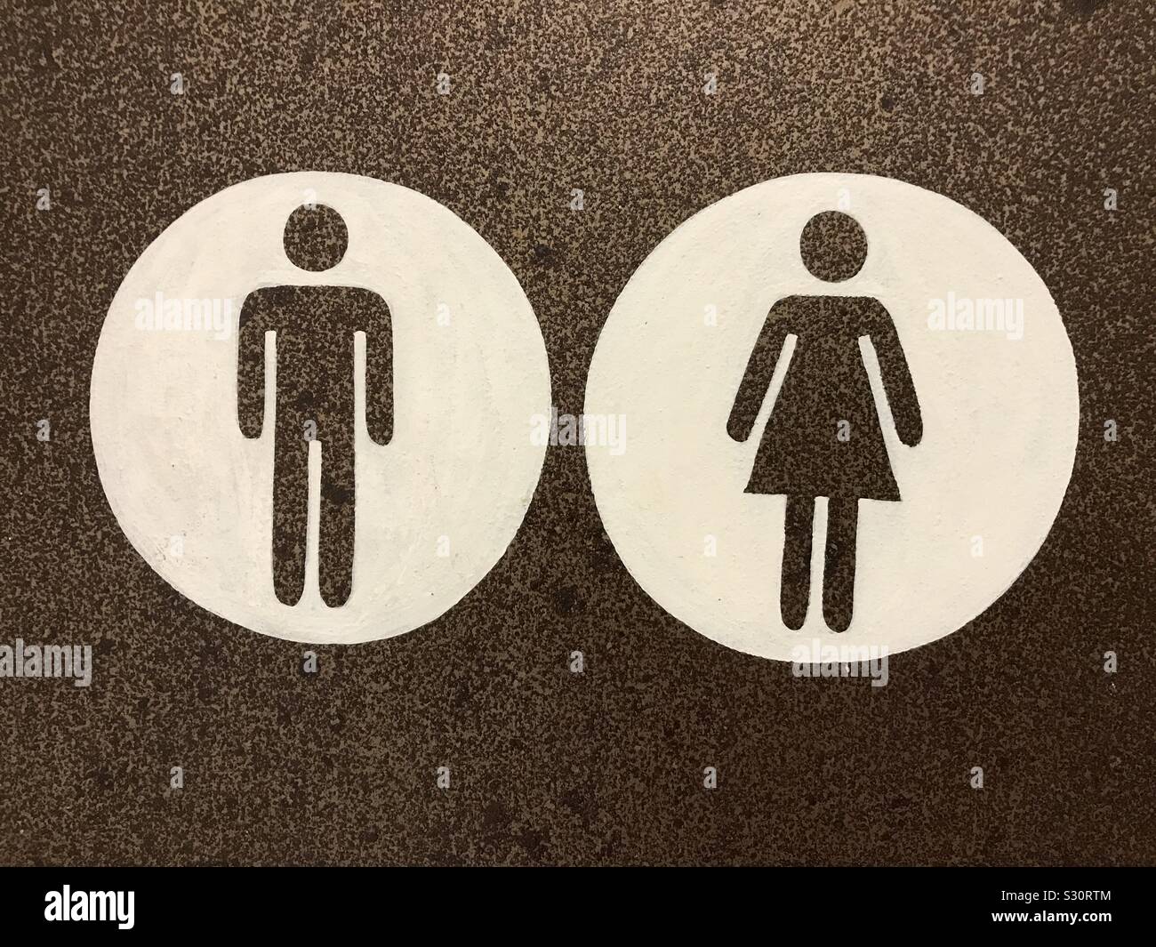 Male and female icons in a unisex toilet door. Stock Photo