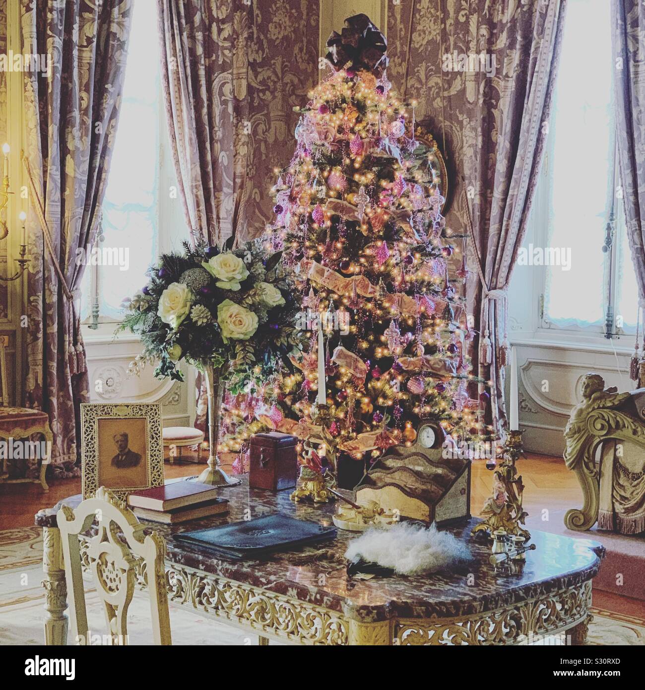 Desk and Christmas tree in a bedroom at Marble House, Newport, Rhode Island, United States - Smartphone Captured Stock Image
