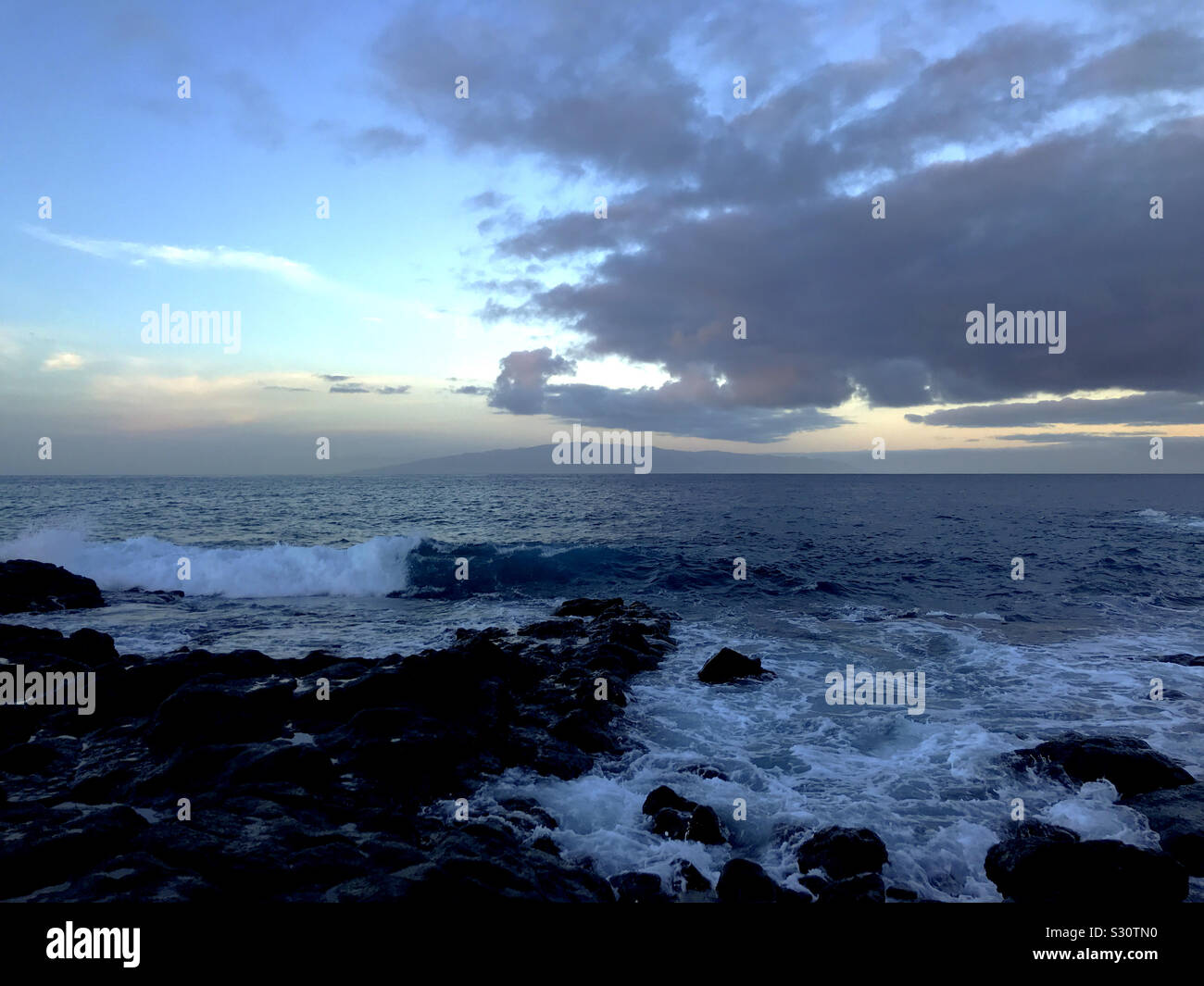 Dawn at the coast in Fonsalia looking west to La Gomera from Tenerife, Canary Islands - Smartphone Captured Stock Image