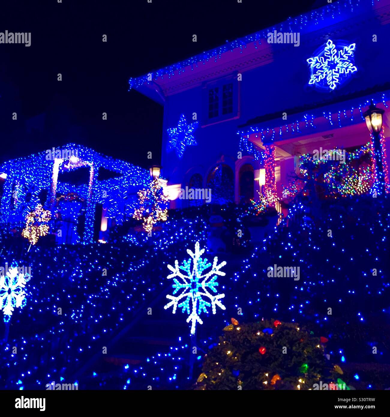 Blue Christmas decorations on a large home in Bay Ridge Brooklyn - Smartphone Captured Stock Image