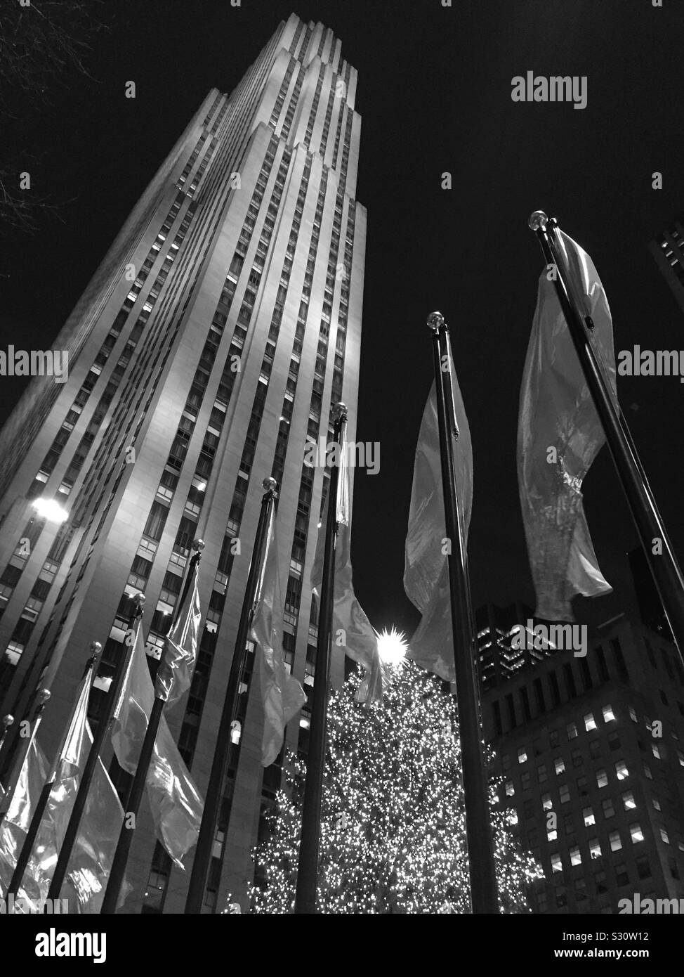 The Iconic Rockefeller Center, Christmas tree at the base of 30 rock in black-and-white, NYC, USA Stock Photo