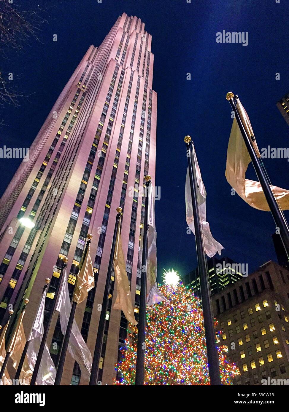 The iconic Christmas tree in Rockefeller Center is at the base of 30 rock skyscraper, NYC, USA Stock Photo