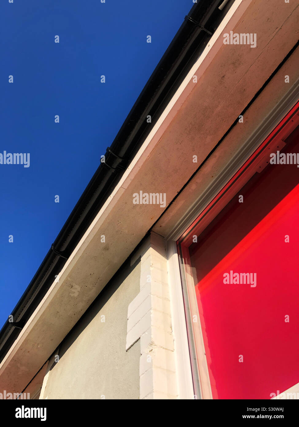 Building detail against a deep blue sky - Smartphone Captured Stock Image