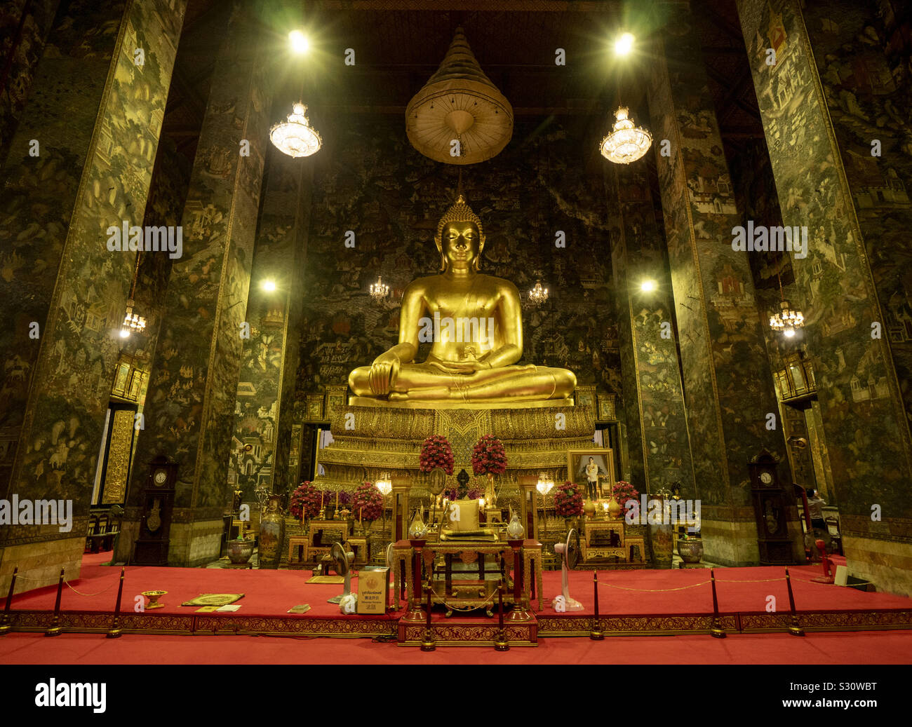Giant golden Buddha statues in temple, - Smartphone Captured Stock Image