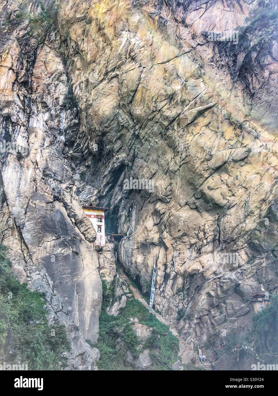 A small temple built into the rock in Bhutan. Stock Photo