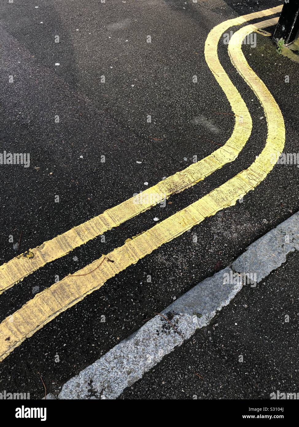 Yellow road paint in London Uk Stock Photo Alamy