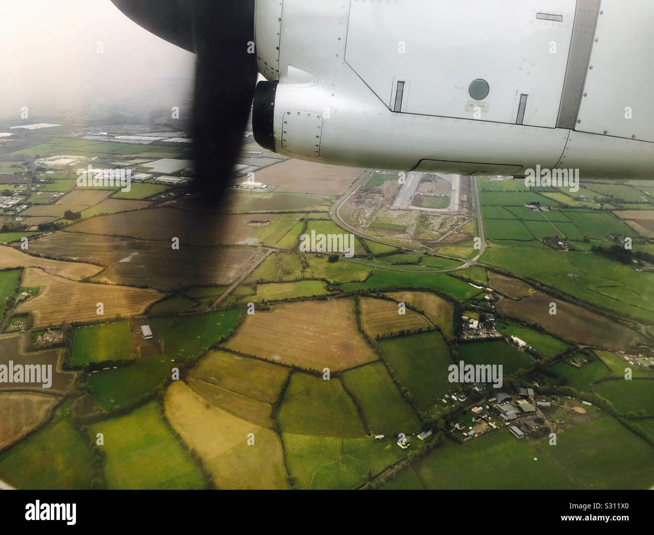Fields near Dublin, Ireland from a turbo prop plane - Smartphone Captured Stock Image