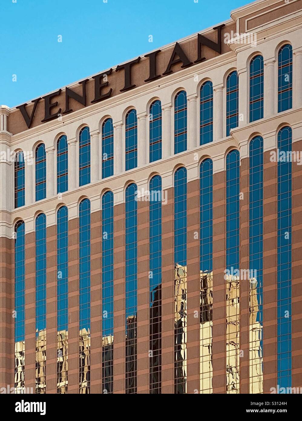 Las Vegas casino with blue sky reflections and buildings on outdoor glass - Smartphone Captured Stock Image