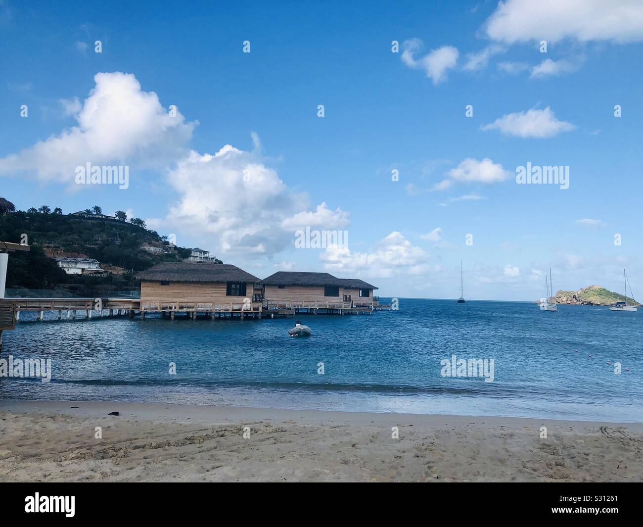 antigua huts on the water