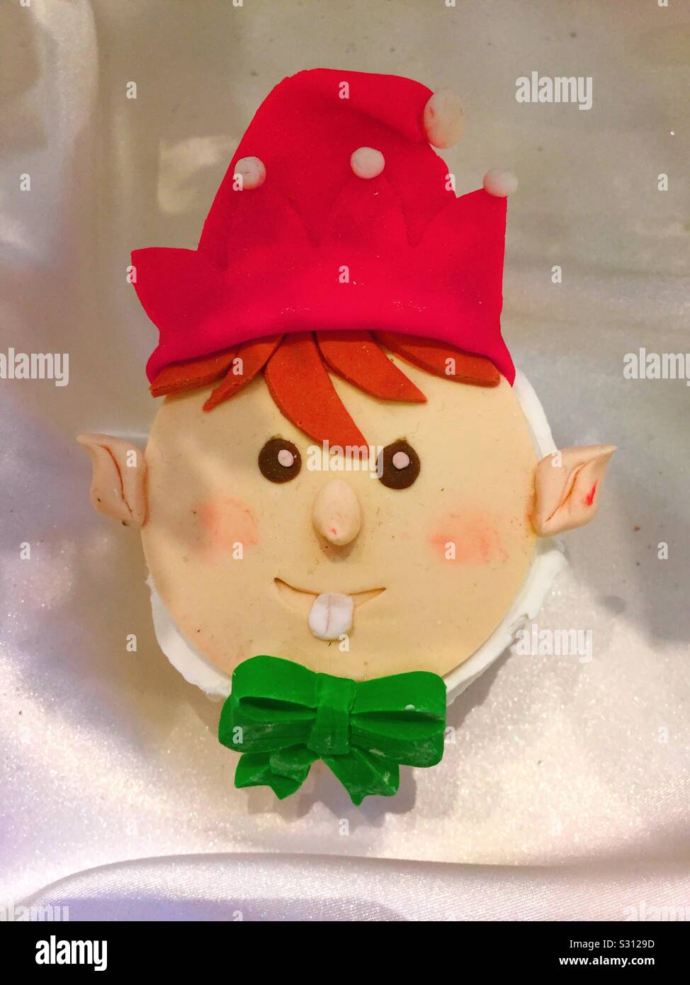 Decorative elf figurine and a holiday display during the Christmas season. - Smartphone Captured Stock Image