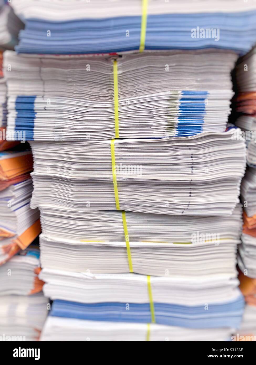 Stacked newspapers ready to be delivered. - Smartphone Captured Stock Image