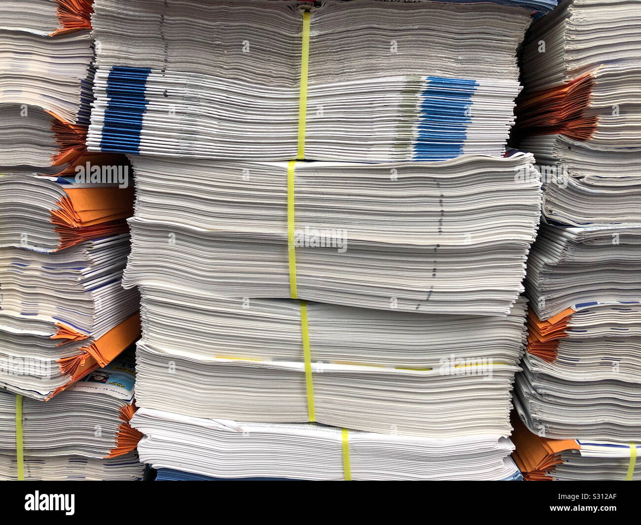 Stacked newspapers ready to be delivered. - Smartphone Captured Stock Image