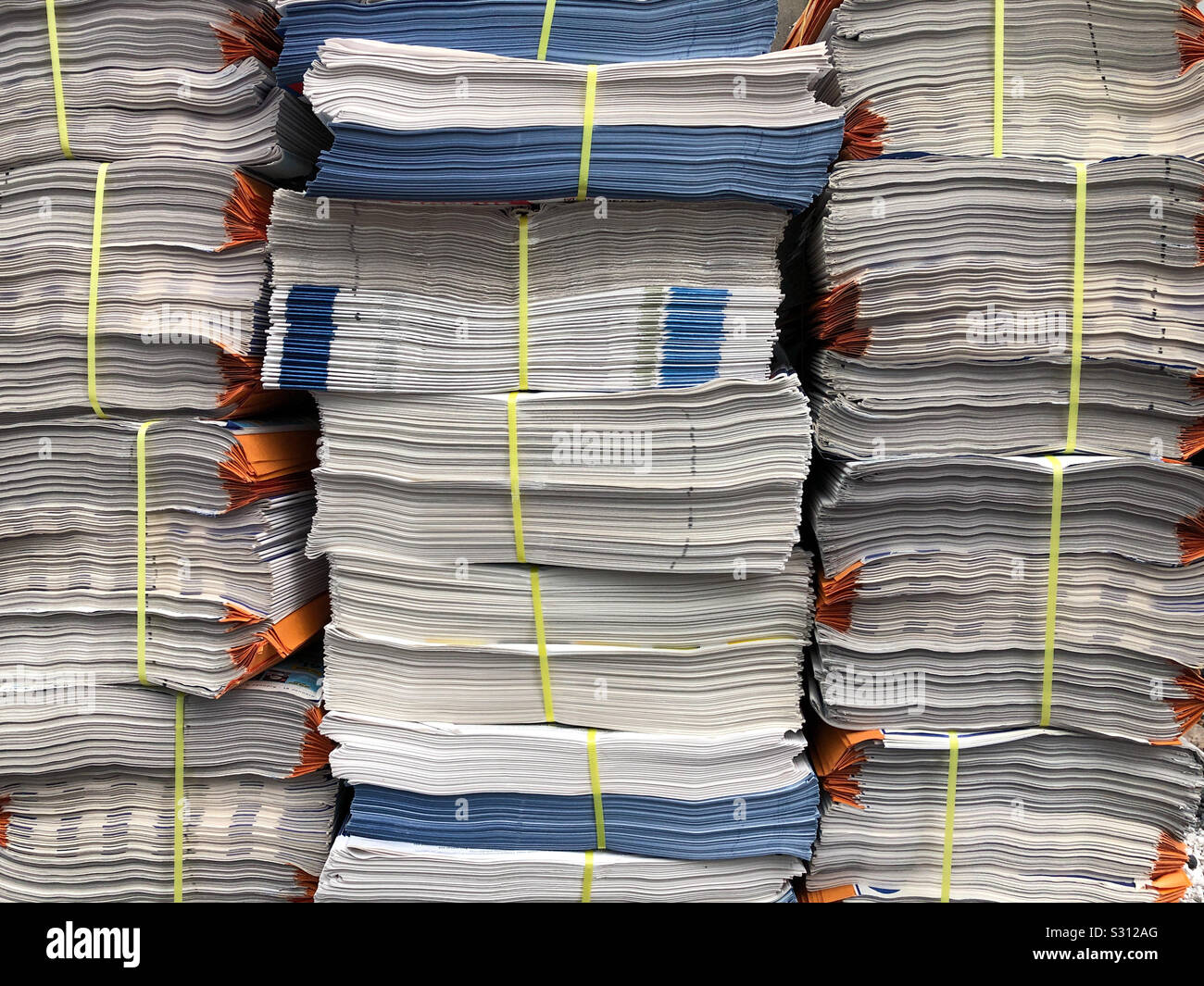Stacked newspapers ready to be delivered. - Smartphone Captured Stock Image