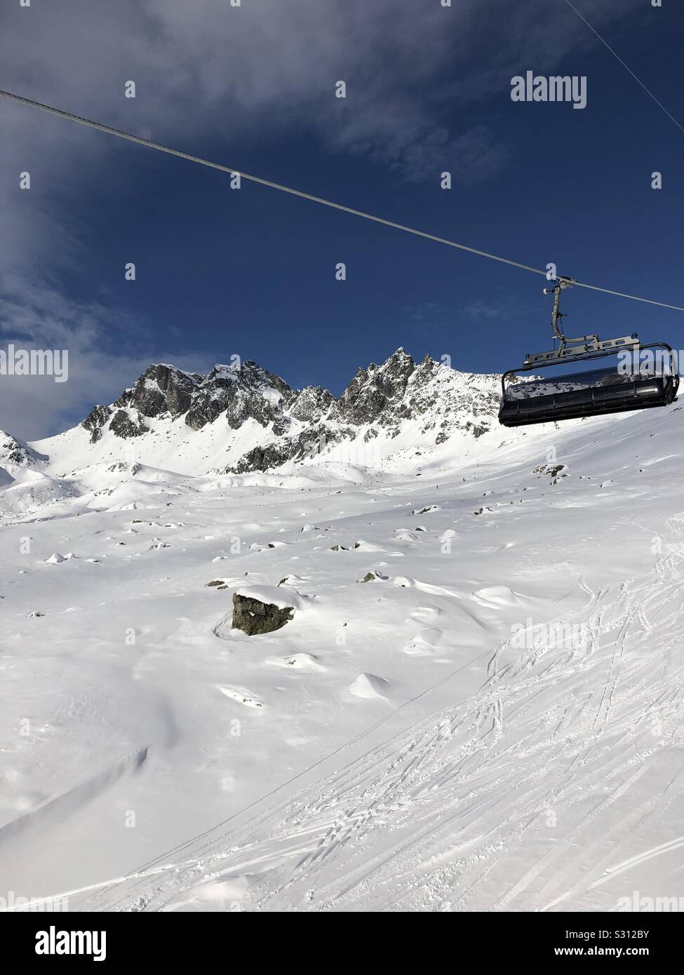 Mountain views from a chair lift Stock Photo