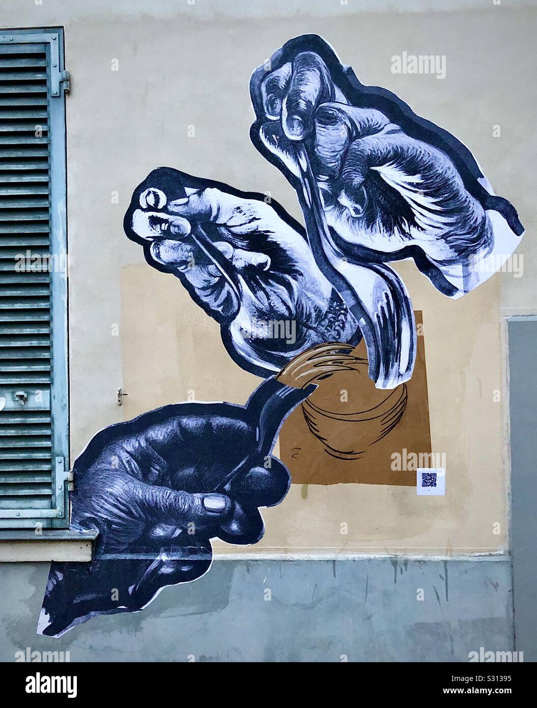 Paper cut-out graffiti mural of hands, Paris 20th arrondissement, France. Stock Photo