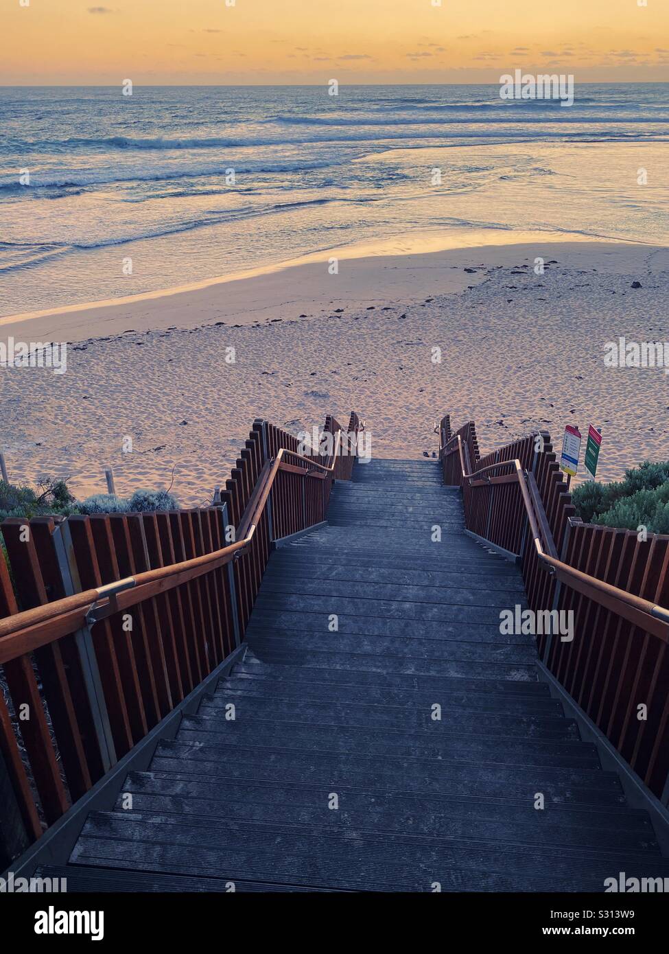 Stairway down to the beach at Surfers Point, Western Australia at sunset. November 2019 - Smartphone Captured Stock Image
