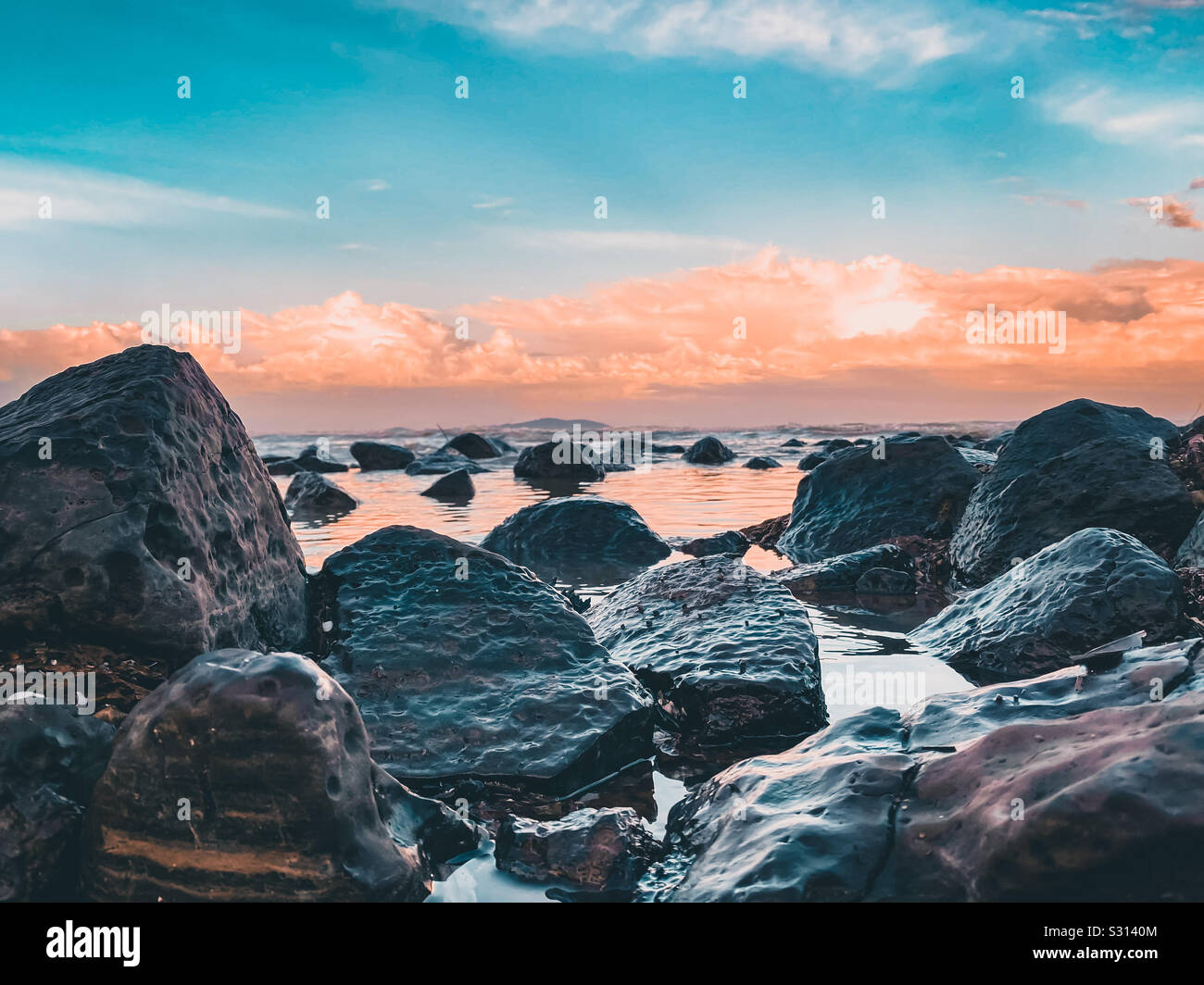 Beautiful Sunset With Stone At Pantai Batu Hitam Malaysia Stock Photo Alamy