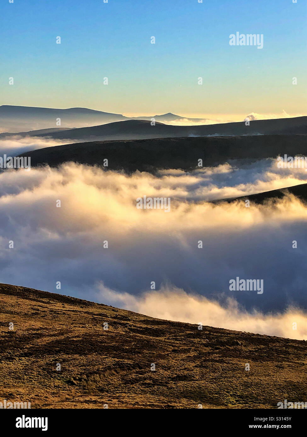 Clouds over the Brecon Beacons, early morning, December. Sugar Loaf mountain in the far distance. - Smartphone Captured Stock Image