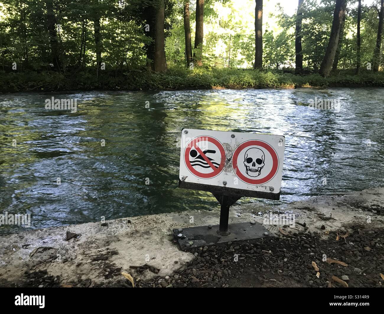 Danger signs for river water in Munich München Germany - Smartphone Captured Stock Image
