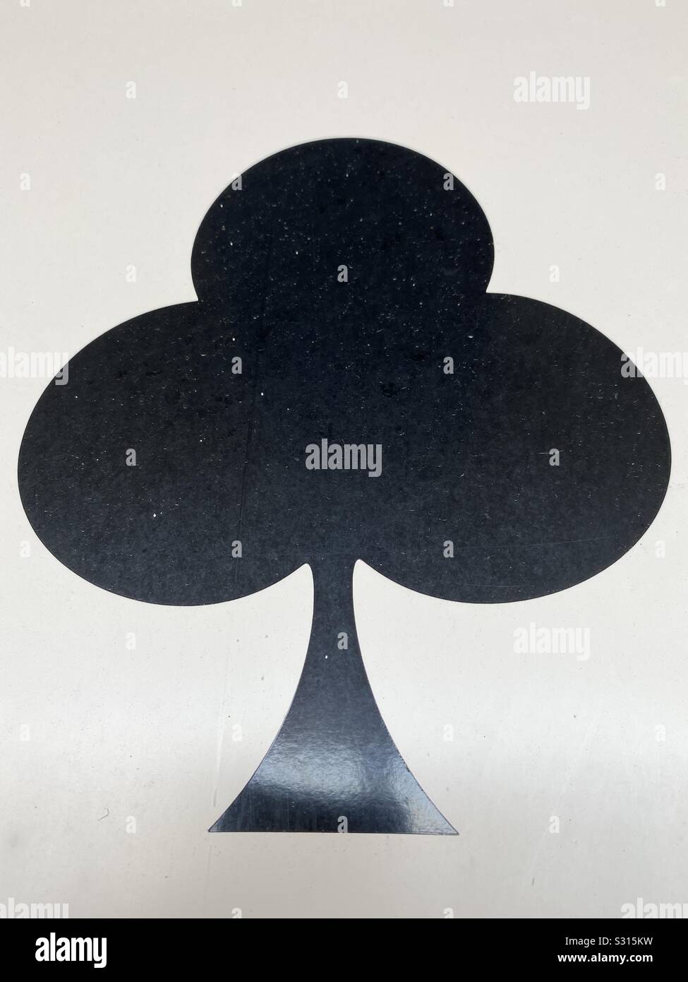 Large black club card on white wall background Stock Photo - Alamy