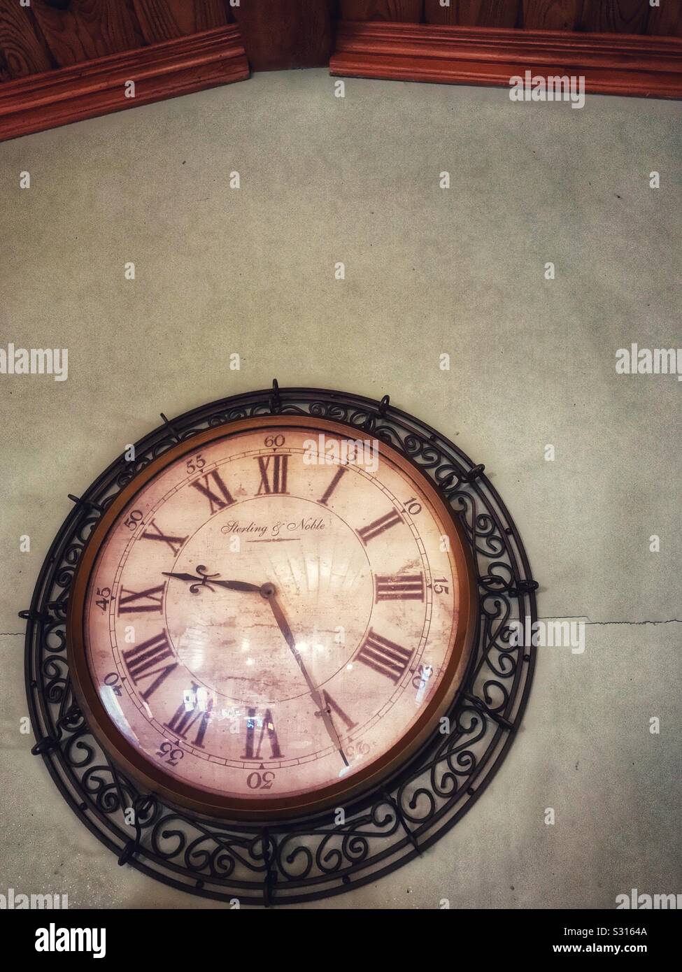 Slightly grungy photo of ornate click on a wall - Smartphone Captured Stock Image