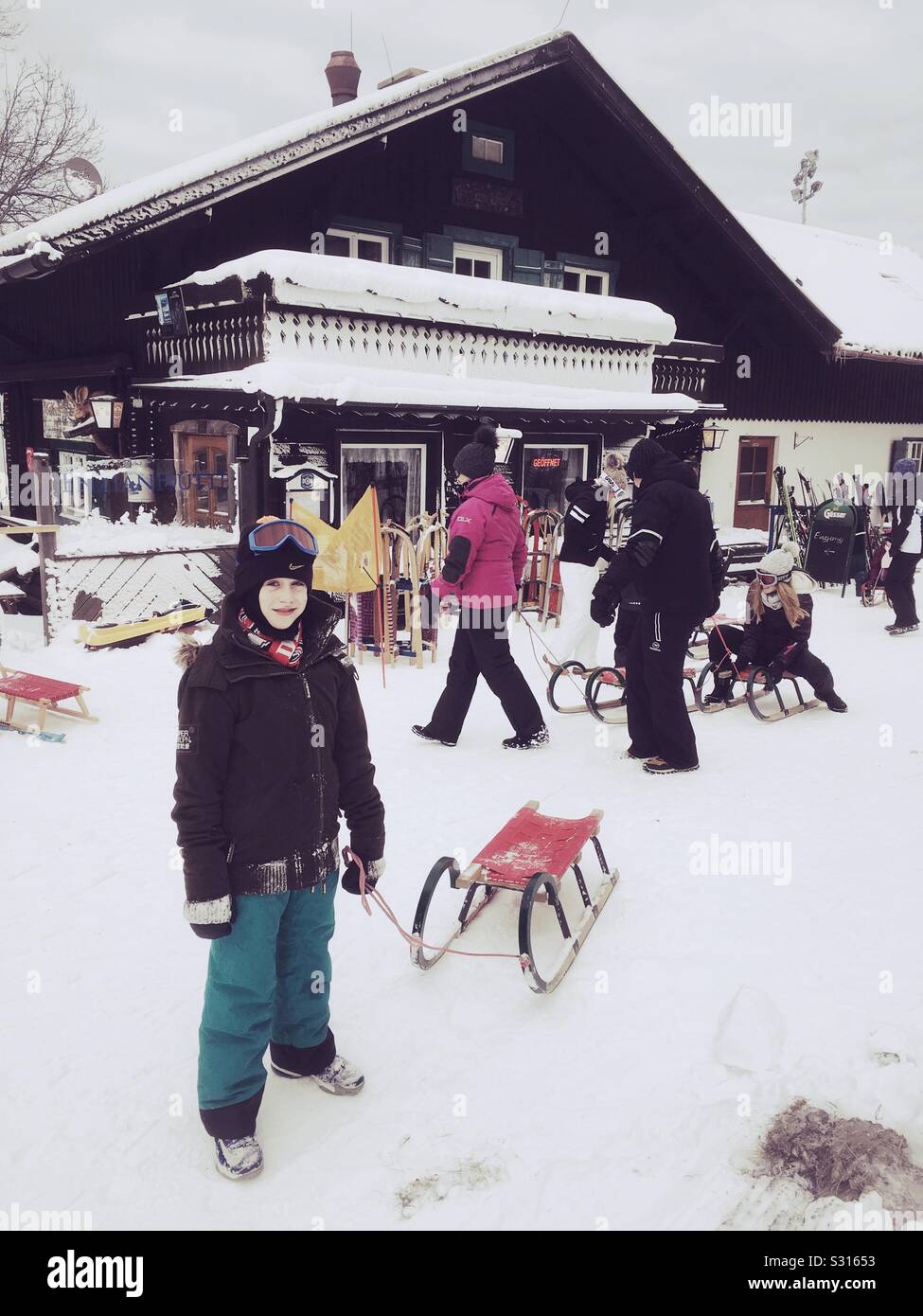 Ten year old boy tobogganing at Semmering, Austria. - Smartphone Captured Stock Image