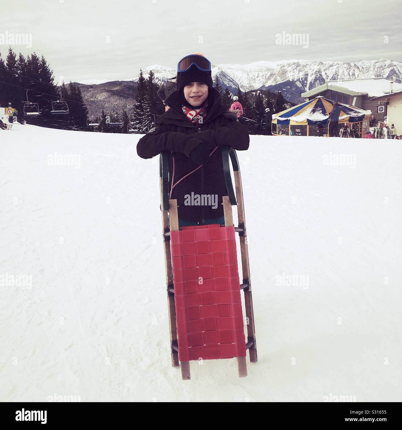 Ten year old boy tobogganing at Semmering, Austria. - Smartphone Captured Stock Image