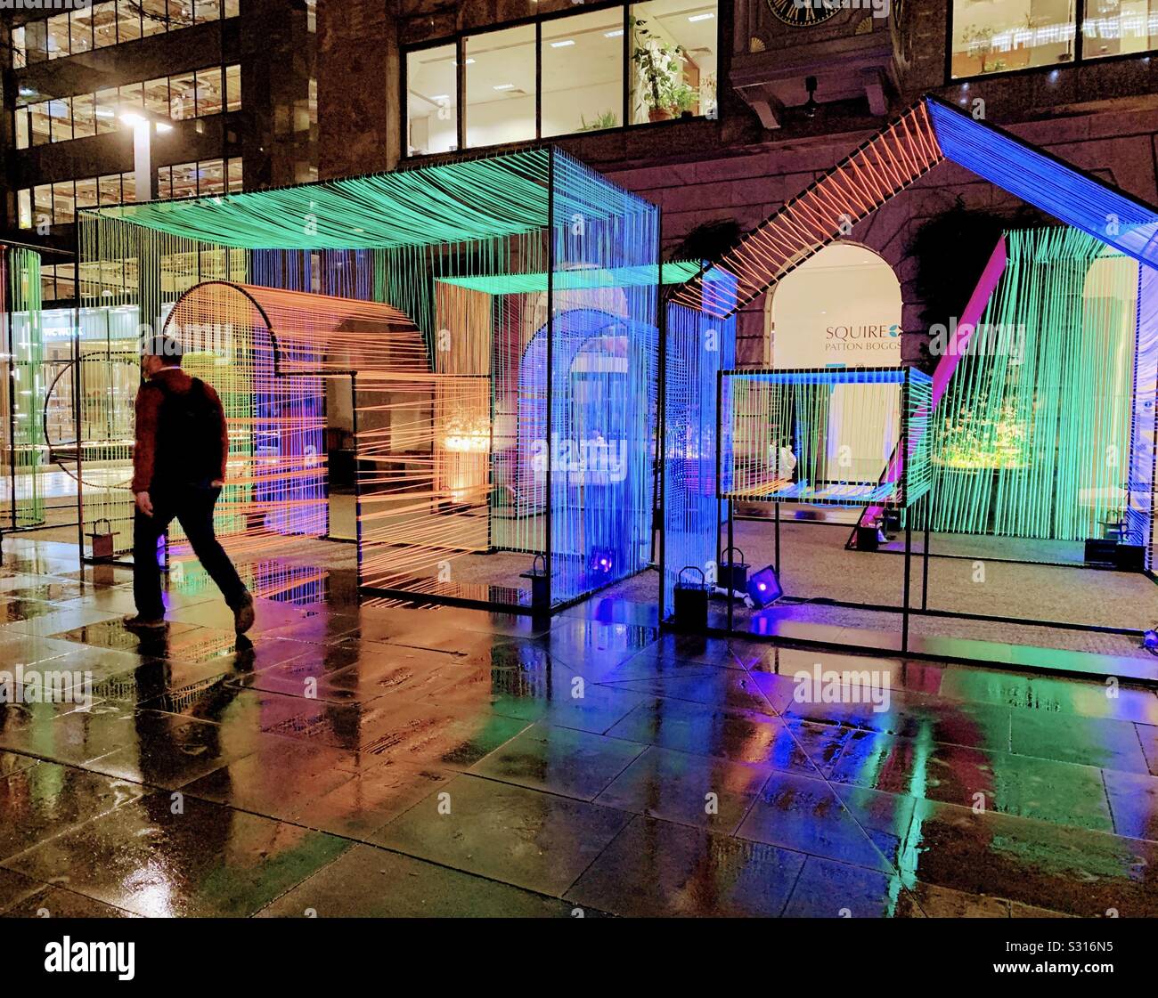Colourful art installation in London’s Devonshire Square on a rainy night in winter - Smartphone Captured Stock Image