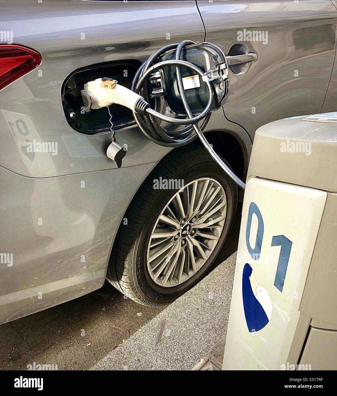 Electric vehicle charging point, Le Marais, Paris, France. - Smartphone Captured Stock Image