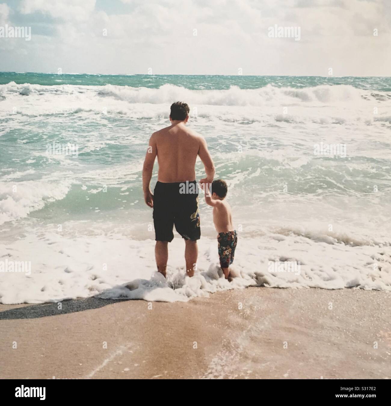 Dad and son at the beach Stock Photo - Alamy