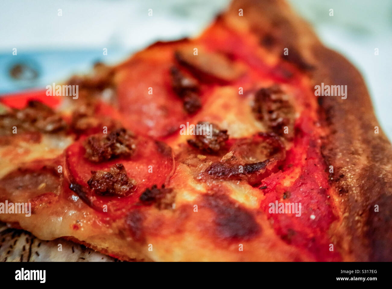 Meat lovers pizza slice - Smartphone Captured Stock Image