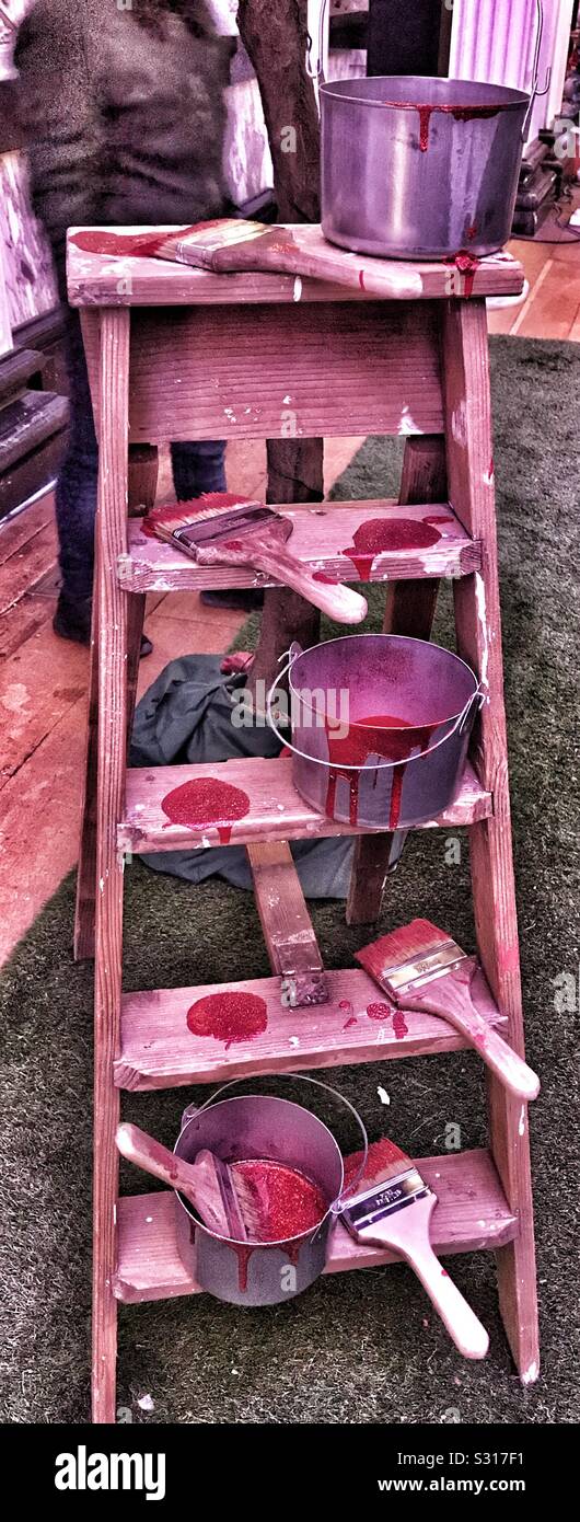 Alice in the Palace at Blenheim Palace Christmas 2019 - Vintage Step Ladder with Paint pots and brushes on them at the Mad Hatters Tea Party - Smartphone Captured Stock Image
